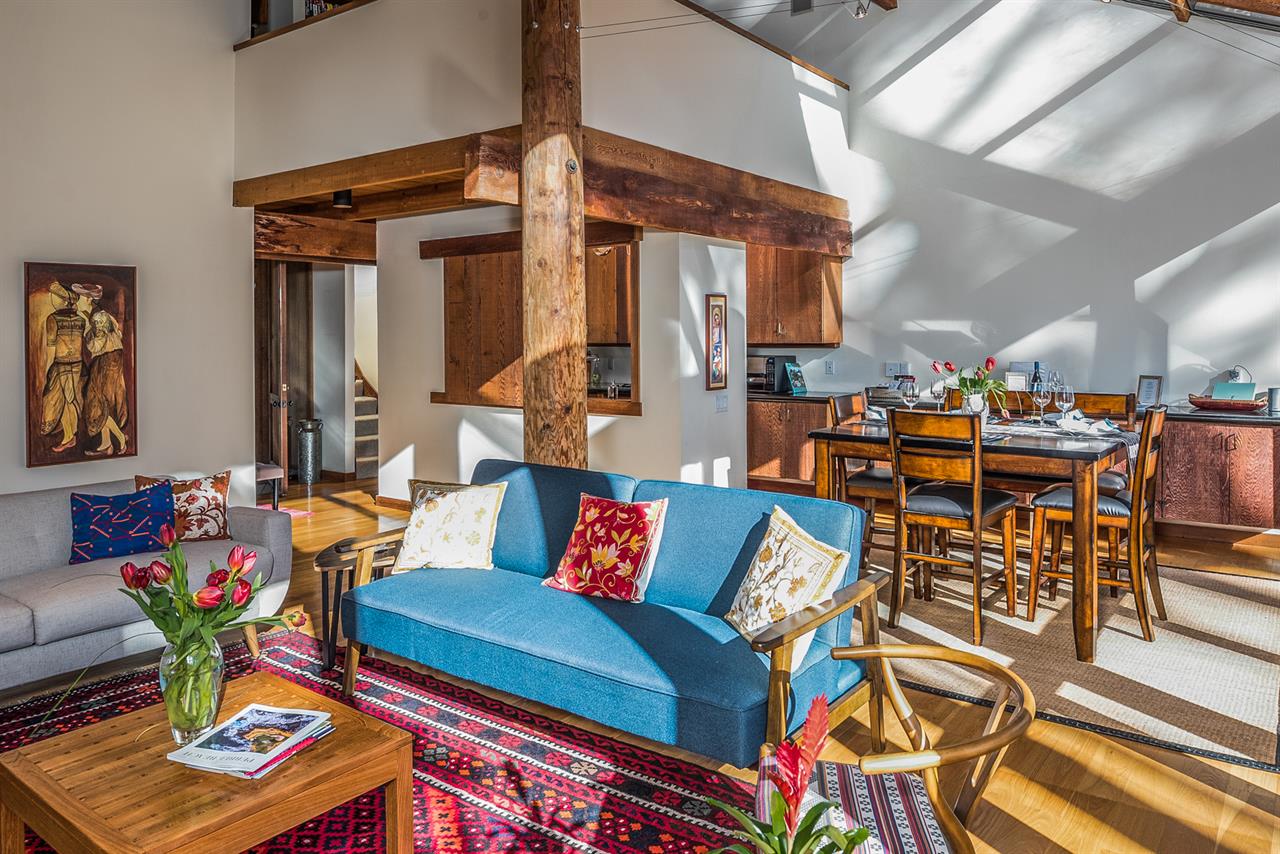 The Home is Filled with Sunlight from Floor to Ceiling Windows