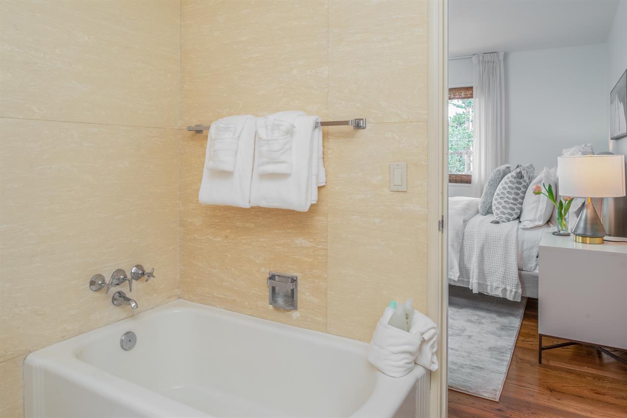 En Suite Guest Bathroom with a Tub