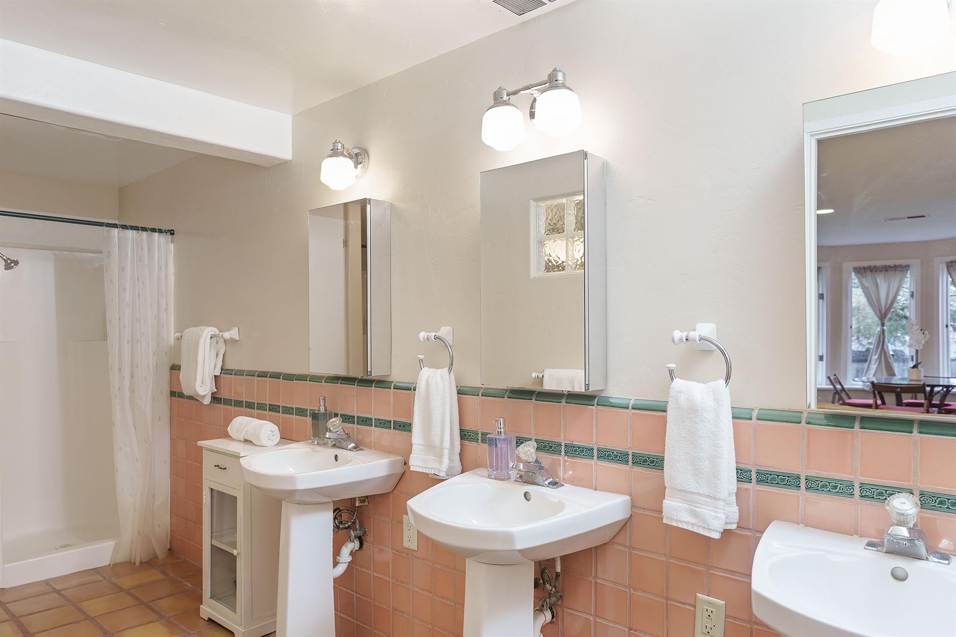 Lower Level Bath  2 Showers, 3 Sinks, Water Closet