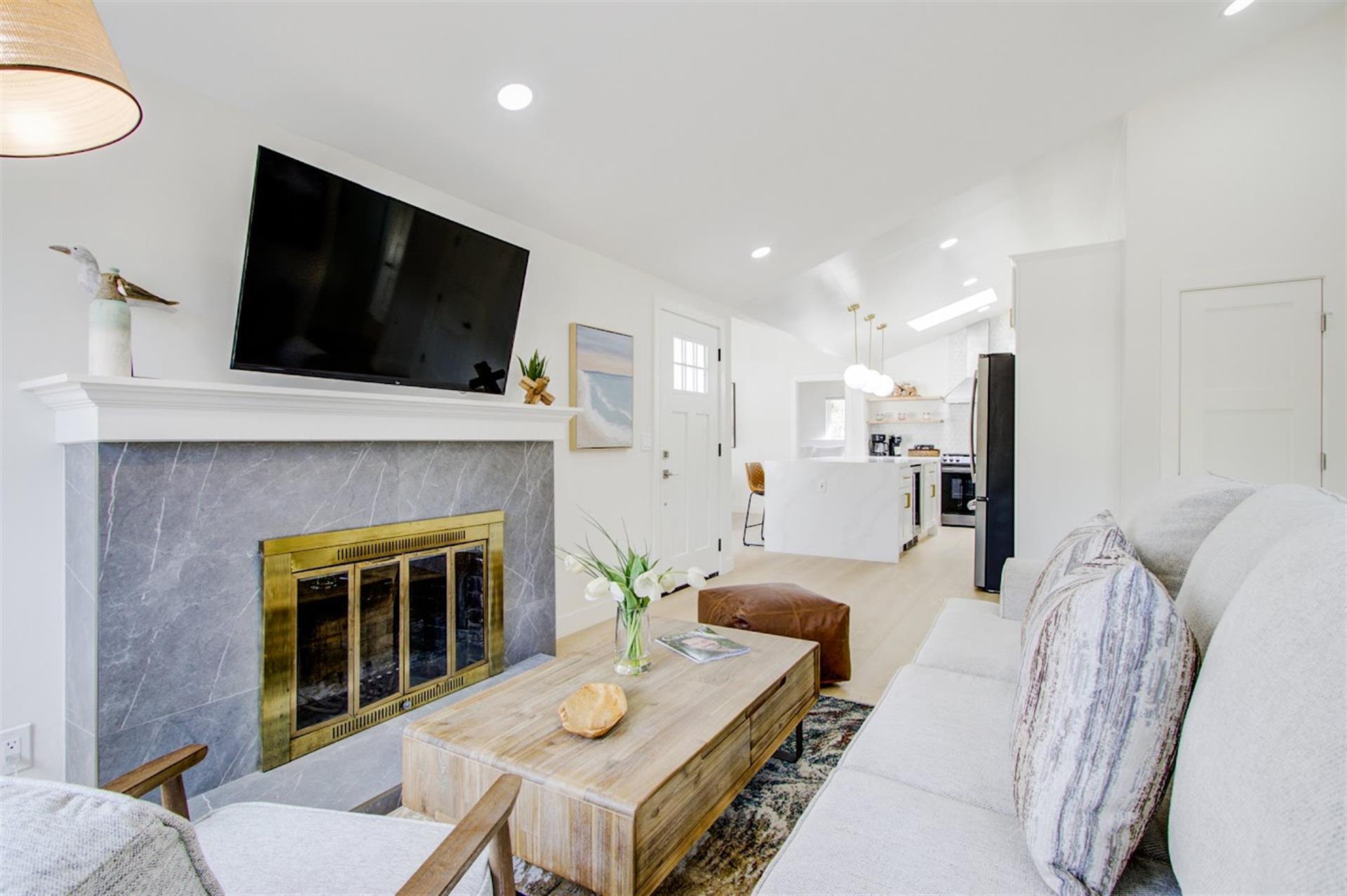 Living Room with Decorative Fireplace and HDTV