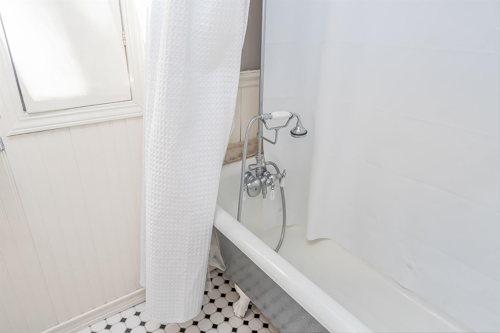 Upstairs  Bathroom has a ClawFoot Tub  Shower Combo