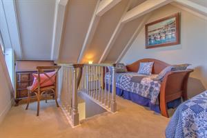 Third Level Loft Has Two Twin Beds and Desk