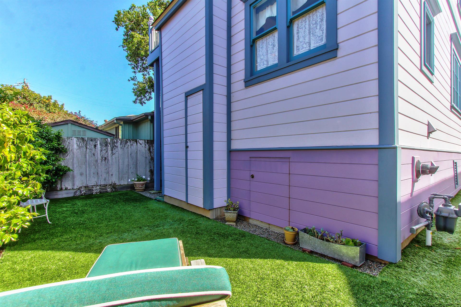 Enclosed Backyard with Synthetic Turf
