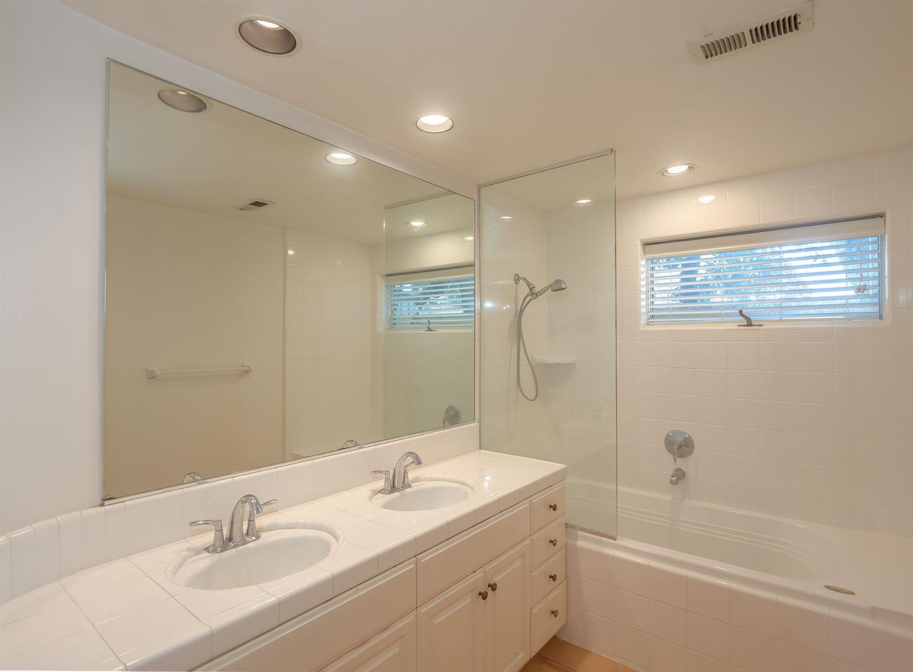 Full Bathroom with Shower Over Tub and Double Vanity