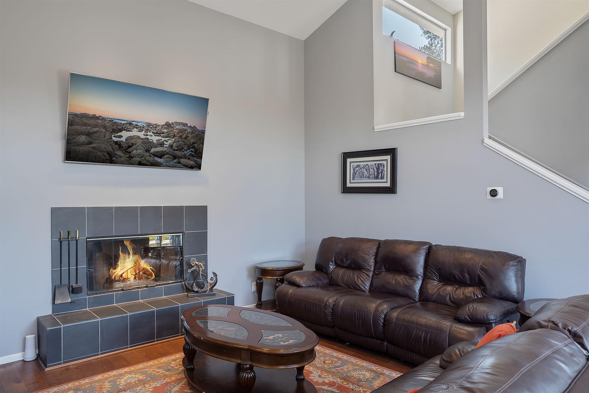 Living Room with a Gas Fireplace  65 HDTV
