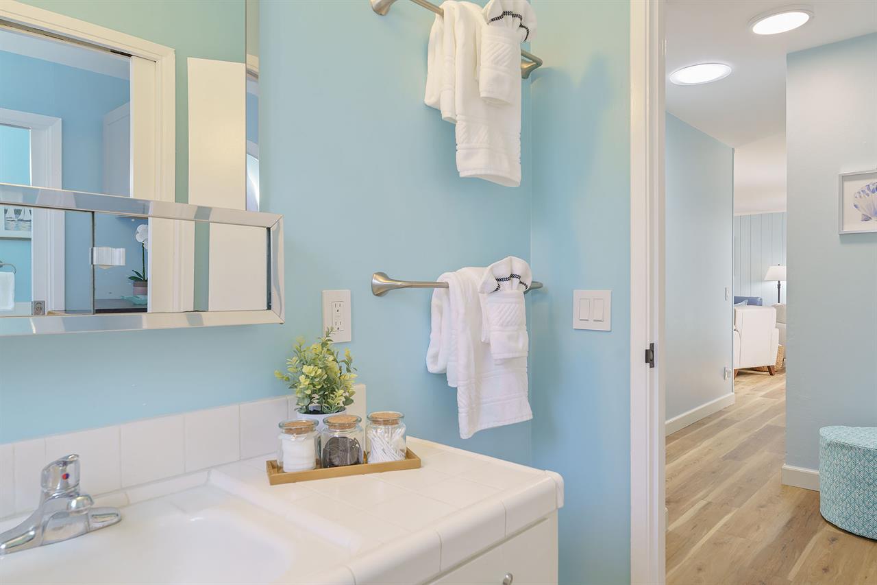 Hall Powder Room Connects to Shared ShowerOverTub