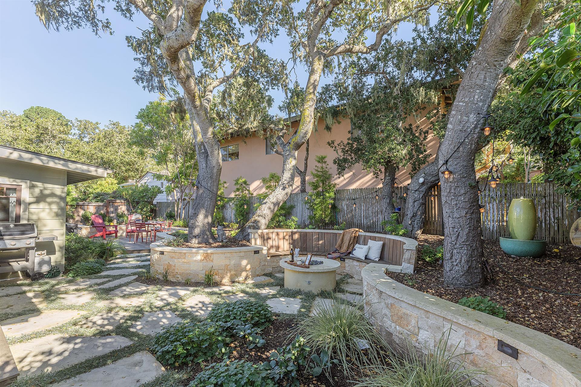 Backyard has a Fire Pit, Gas BBQ, Dining Area and Hot Tub