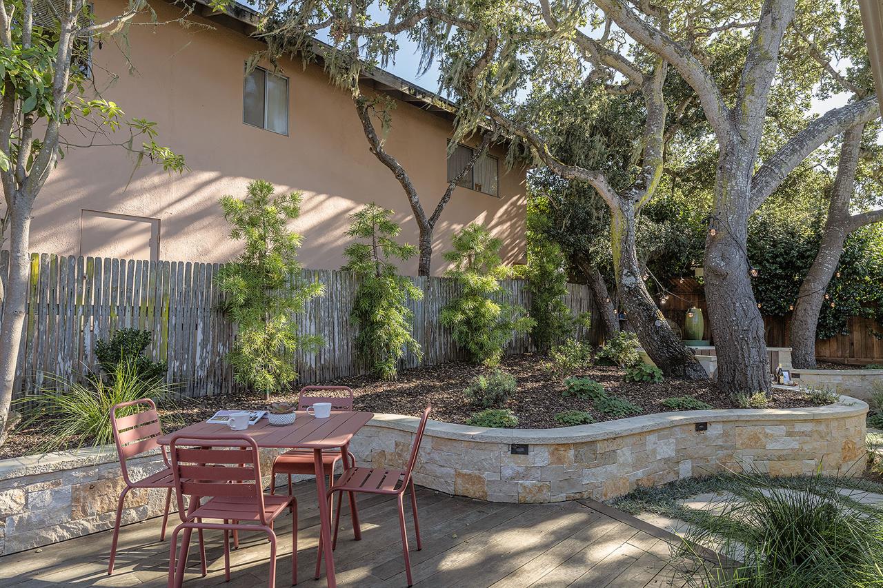 Backyard has a Gas Grill and Dining Area