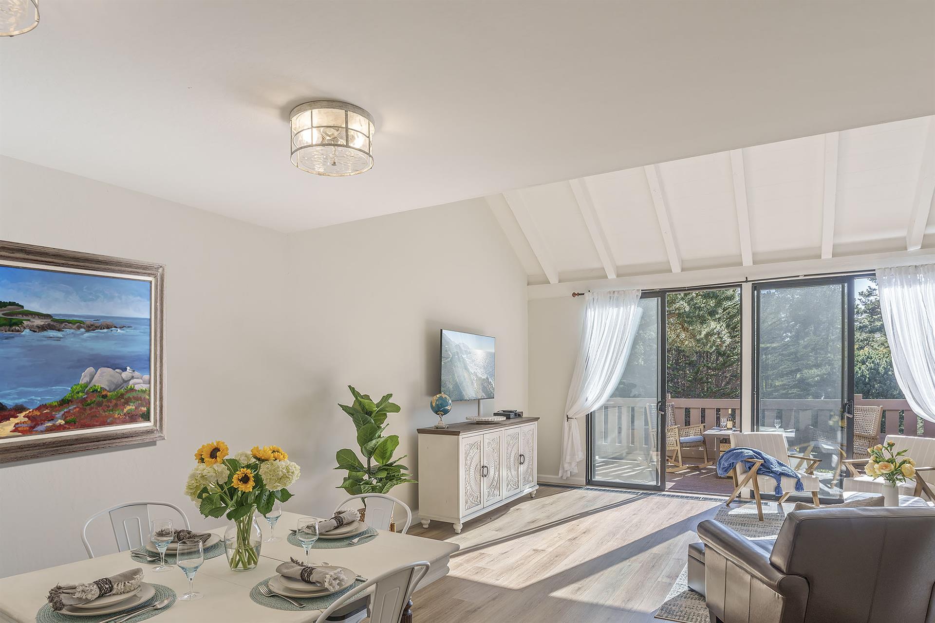 Living Room with HDTV, Balcony and Vaulted Ceiling