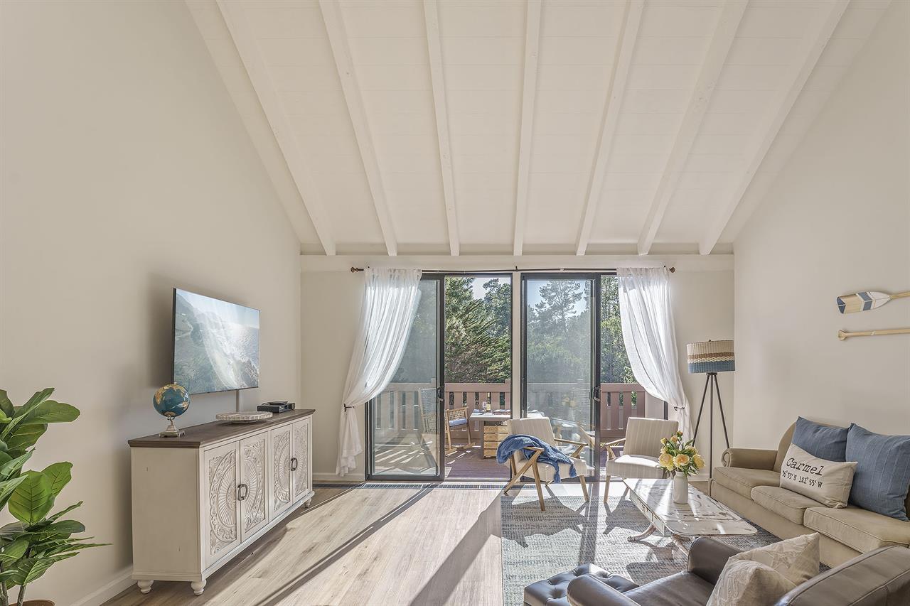 Living Room with HDTV, Balcony and Vaulted Ceiling
