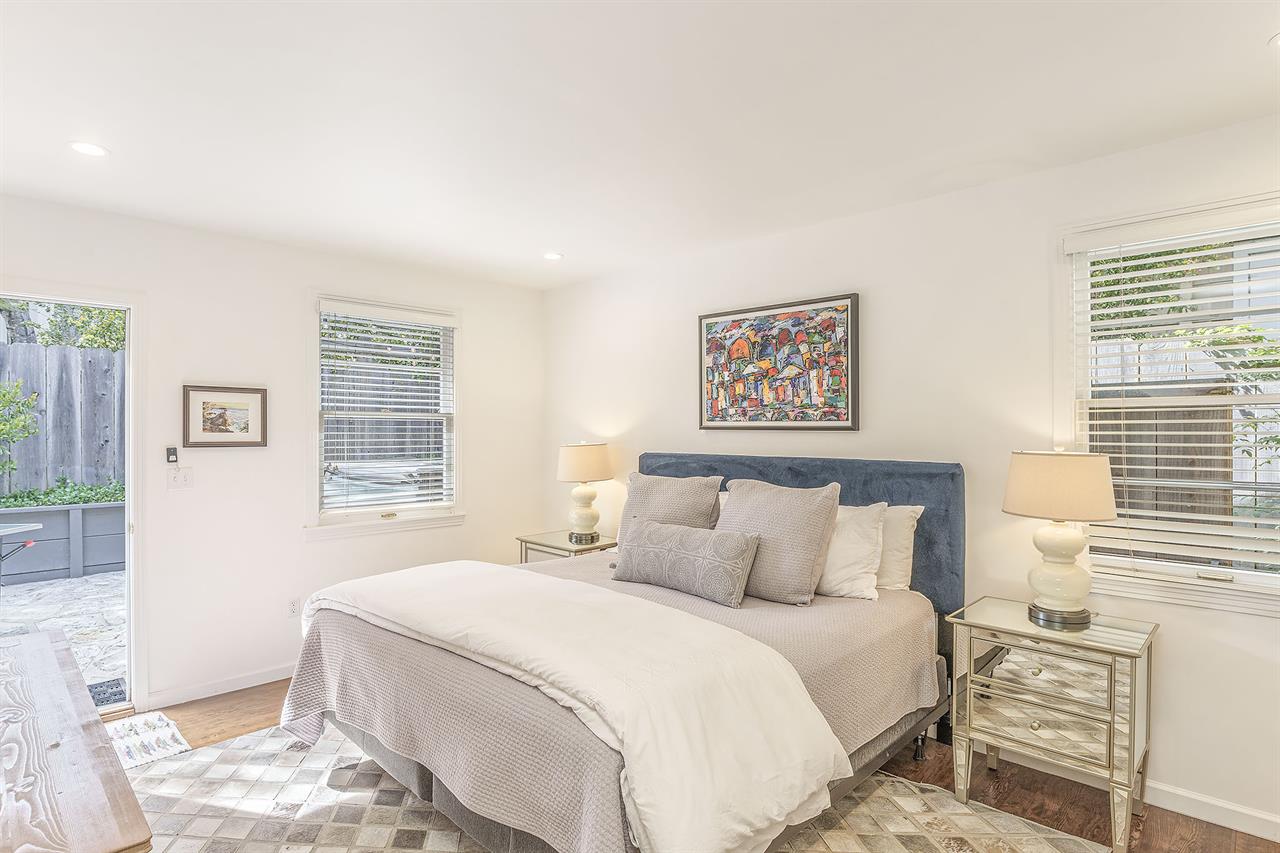 Bedroom 2. King Bed, TV, Patio Access