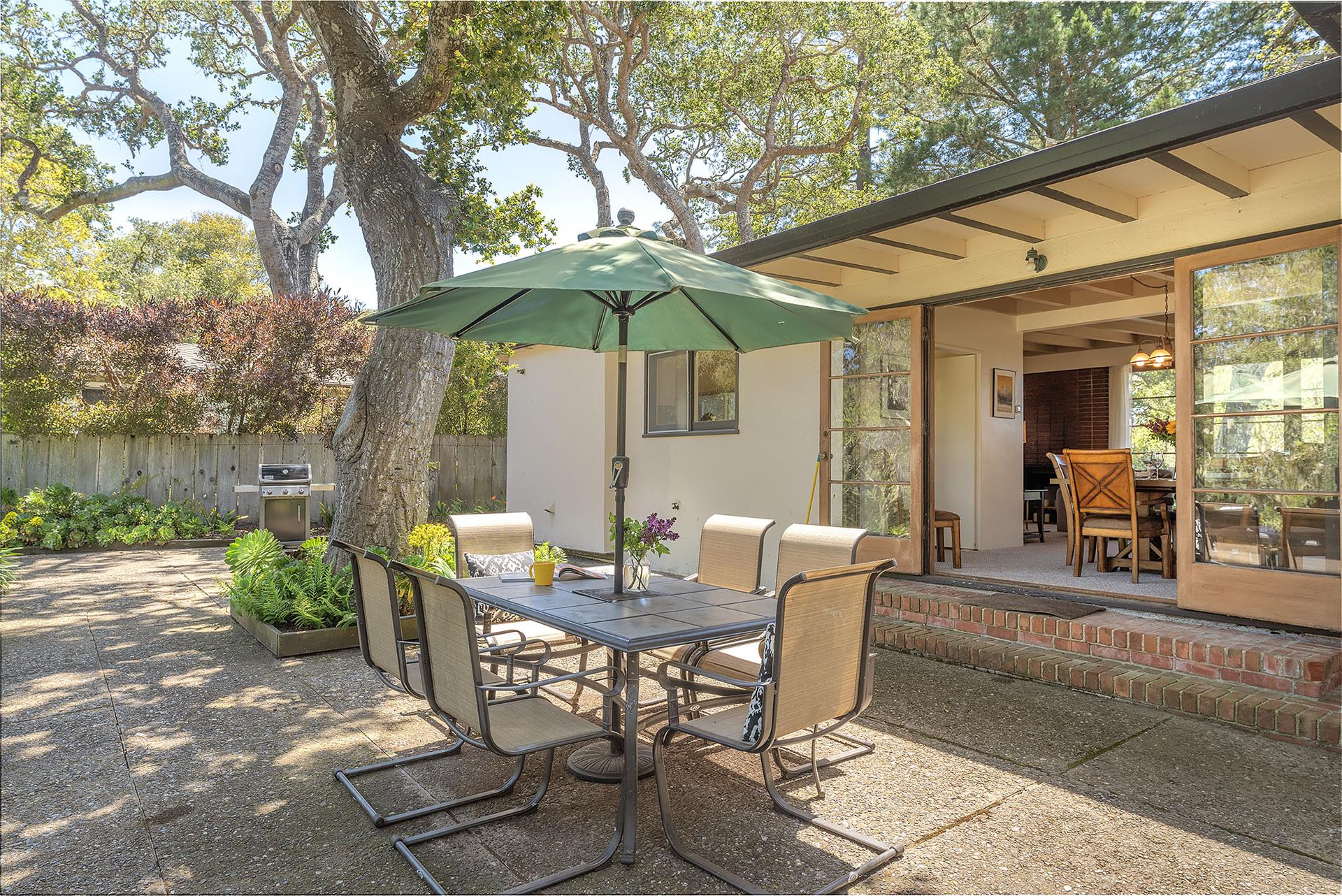 Backyard has a Gas Grill and Dining for Six