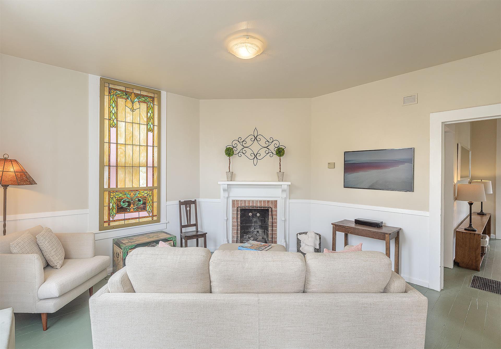 Living Room with CandleLit Fireplace and HDTV