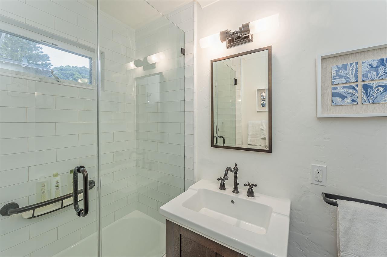 Full Hall Bathroom has a Tiled Shower