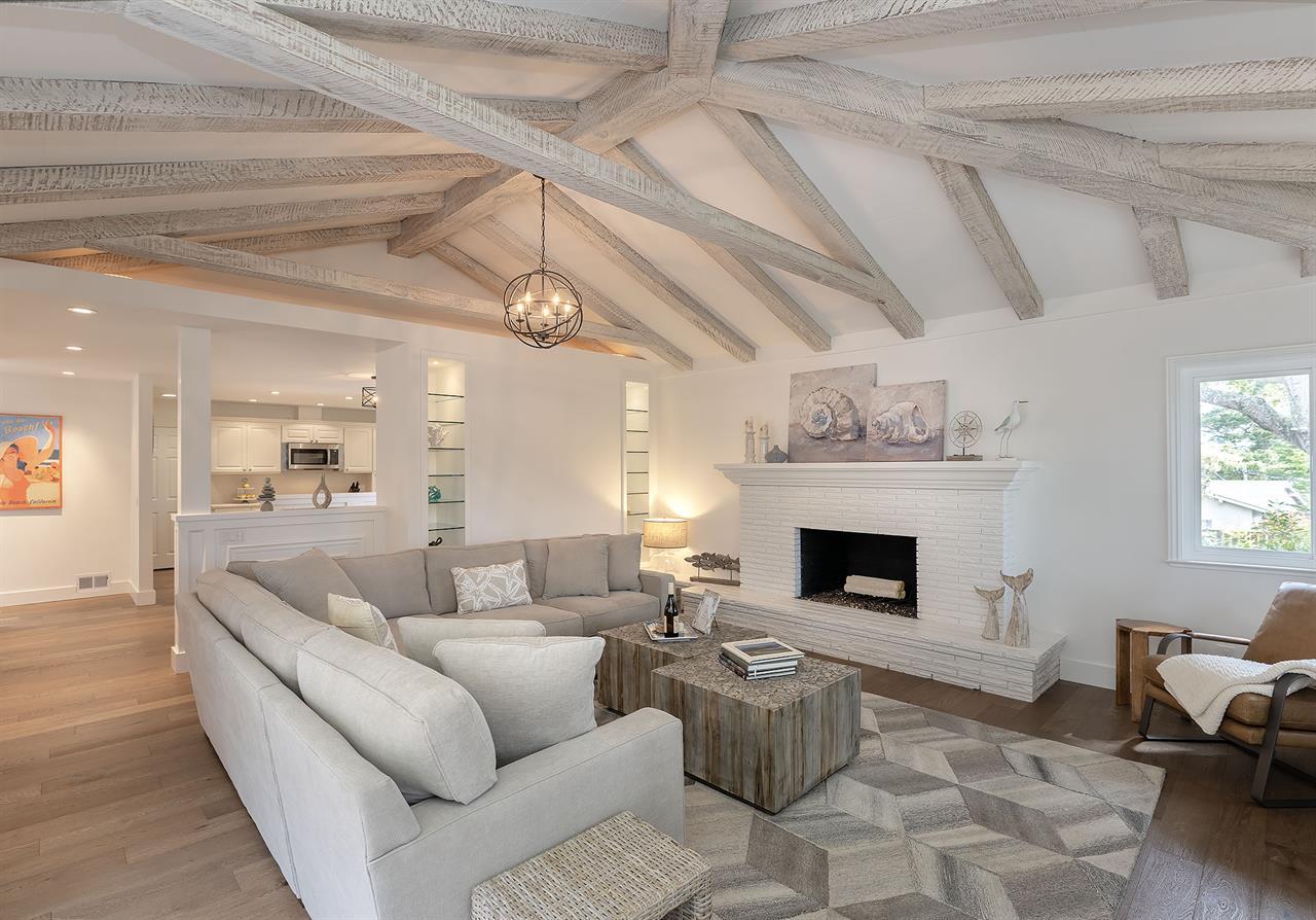 Family Room with Decorative Candlelit Fireplace and HDTV
