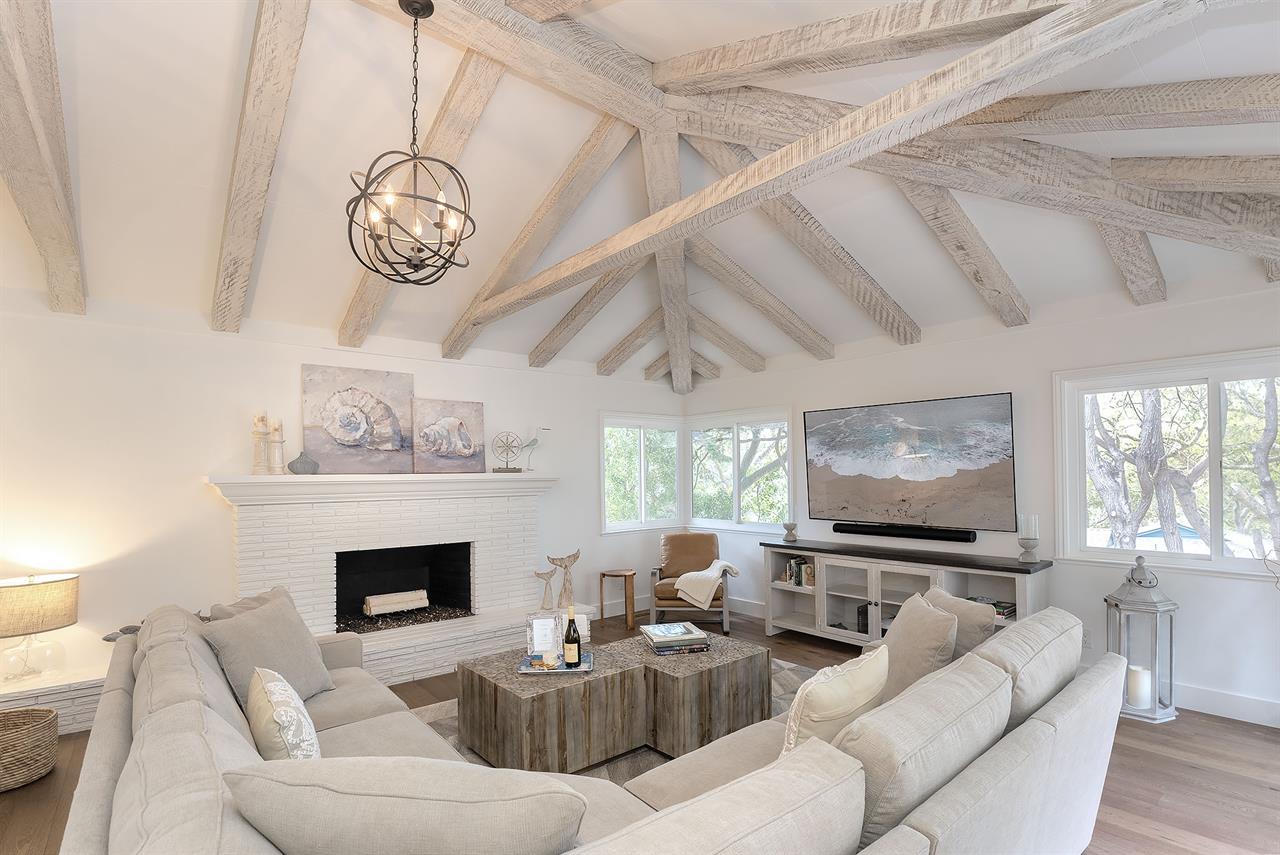 Family Room with Decorative Candlelit Fireplace and HDTV
