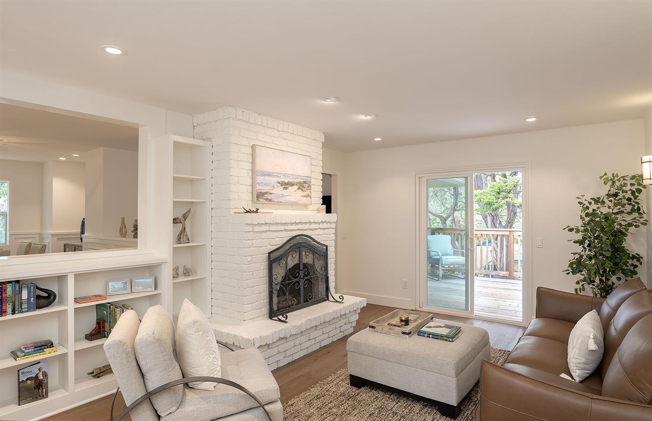 Living Room with Decorative Candlelit Fireplace
