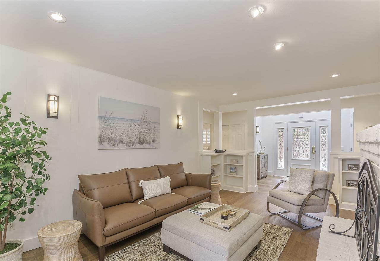 Living Room with Decorative Candlelit Fireplace