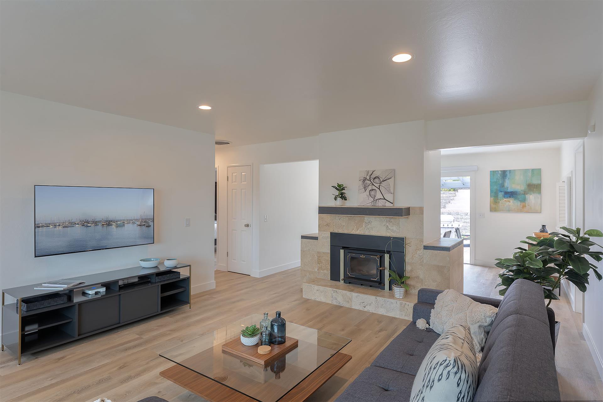Living Room with a Candlelit Fireplace and HDTV