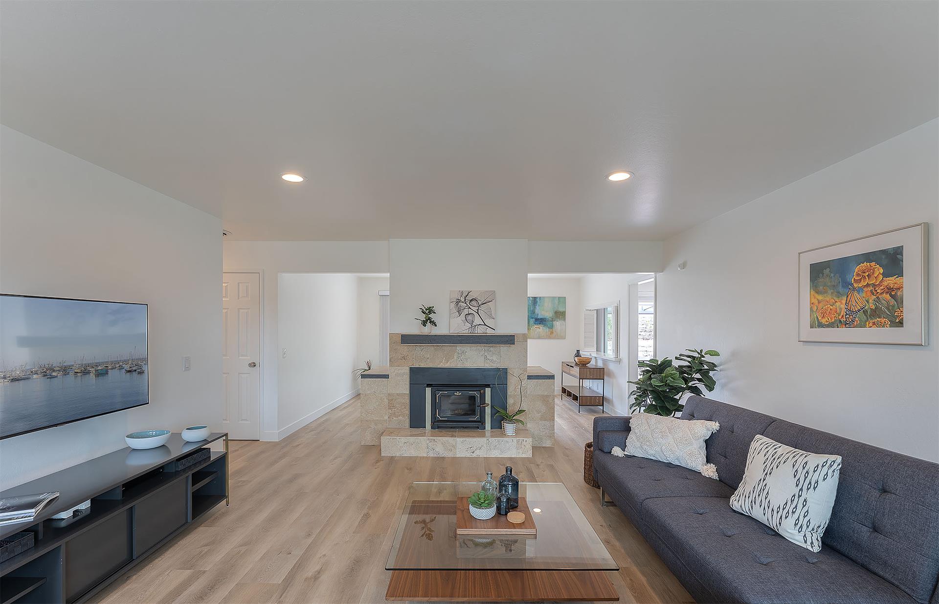 Living Room with a Candlelit Fireplace and HDTV