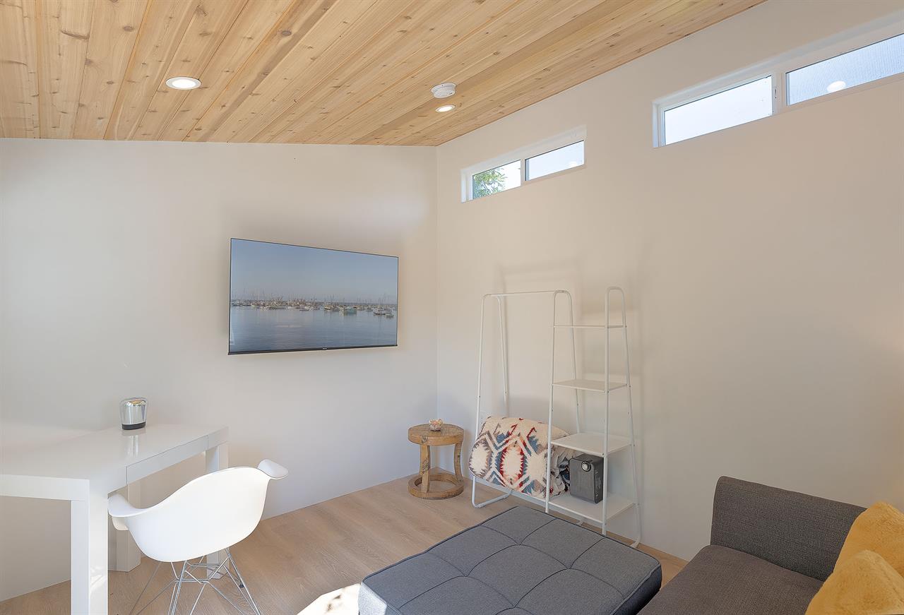 Detached Bonus Room in the Backyard has a Large Smart TV