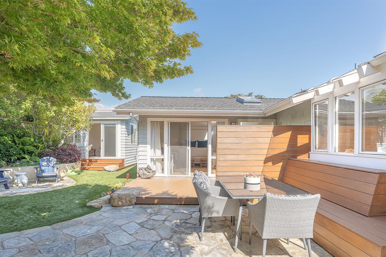 Backyard with Gas BBQ Grill Dining Area and a Hot Tub