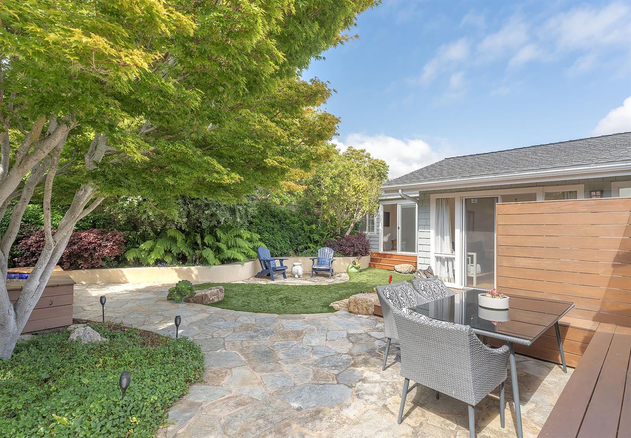 Backyard with Gas BBQ Grill Dining Area and a Hot Tub