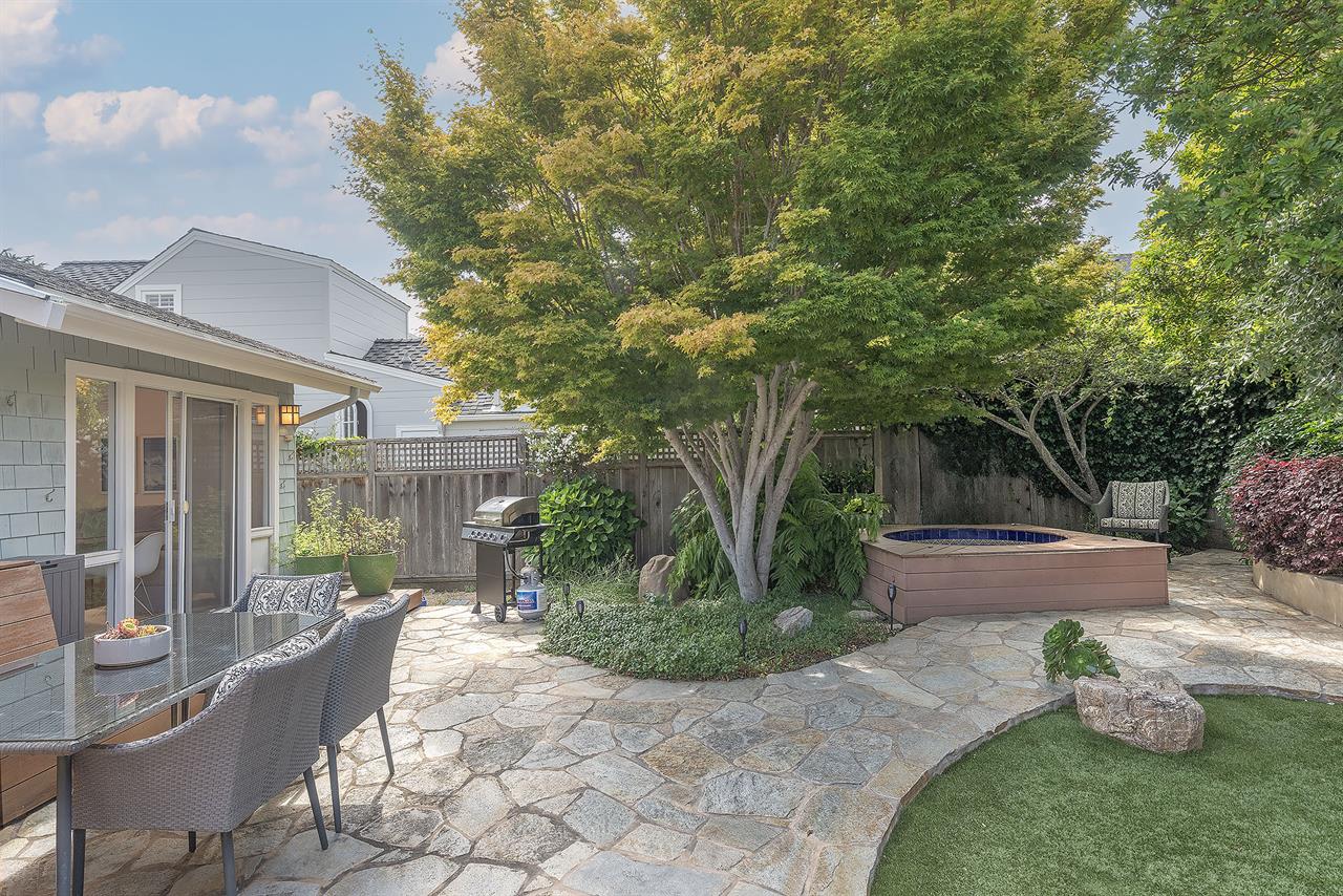 Backyard with Gas BBQ Grill Dining Area and a Hot Tub