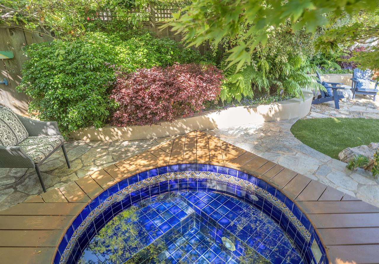 Backyard with Gas BBQ Grill Dining Area and a Hot Tub