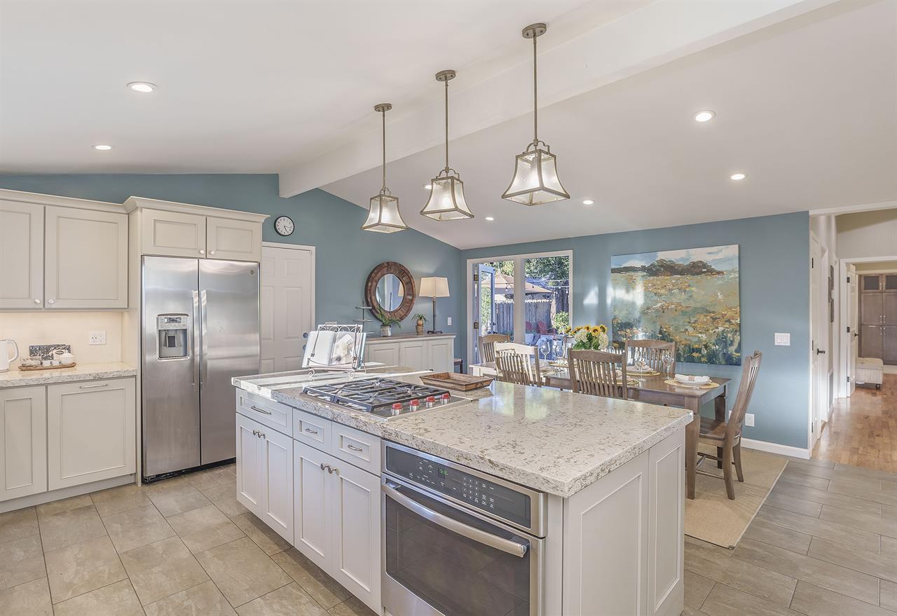 Updated Kitchen with Island and Stainless Steel Appliances