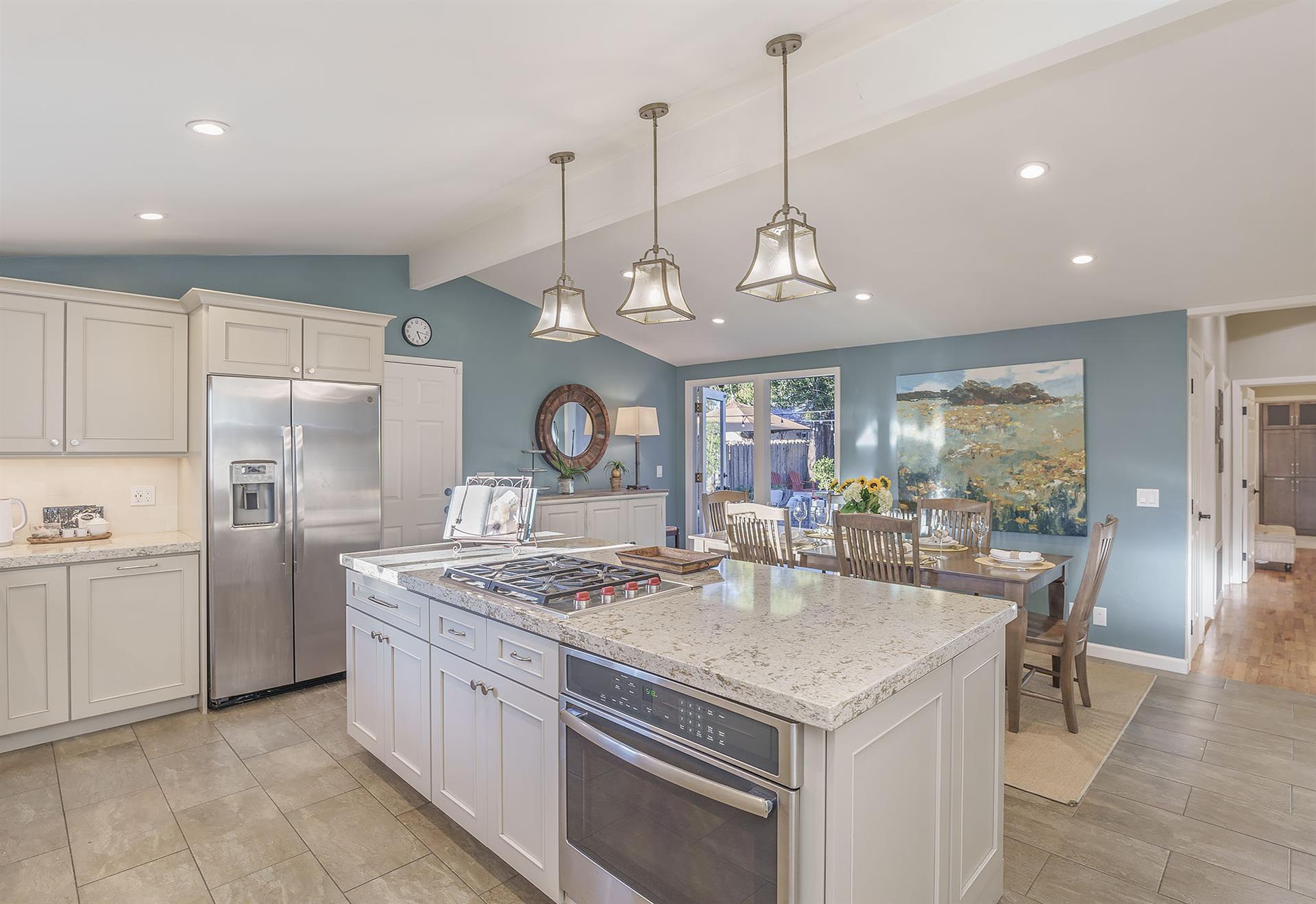 Updated Kitchen with Island and Stainless Steel Appliances