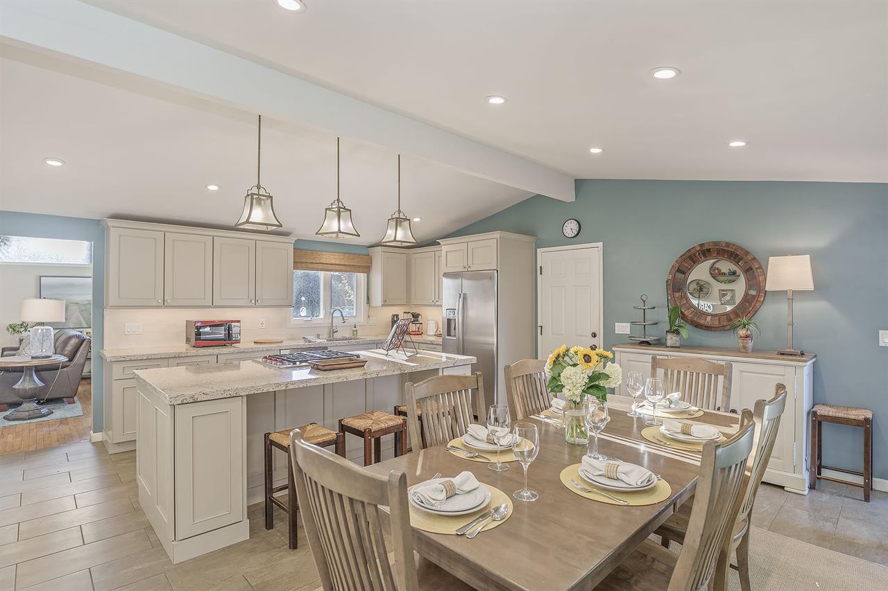 Kitchen with Large IslandCounter Seating and Dining Table