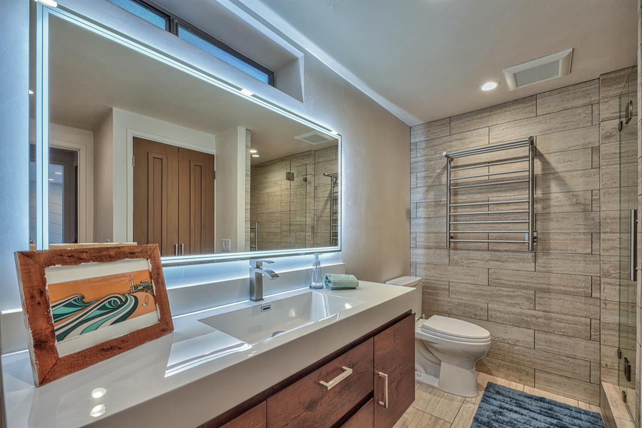 Downstairs Full Bathroom with Shower and Laundry Center