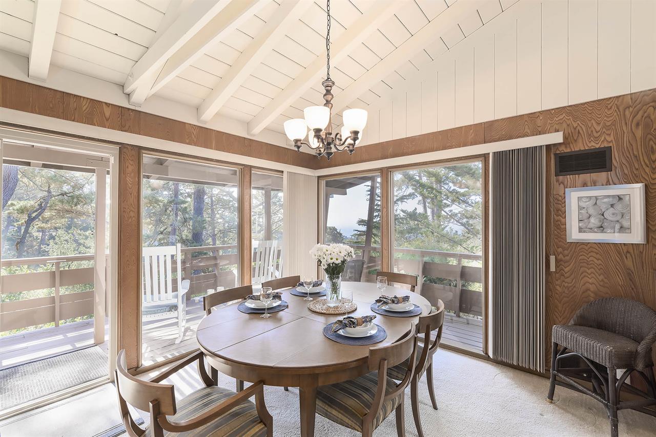 Dining Area has Sliding Doors Leading Out to the Deck