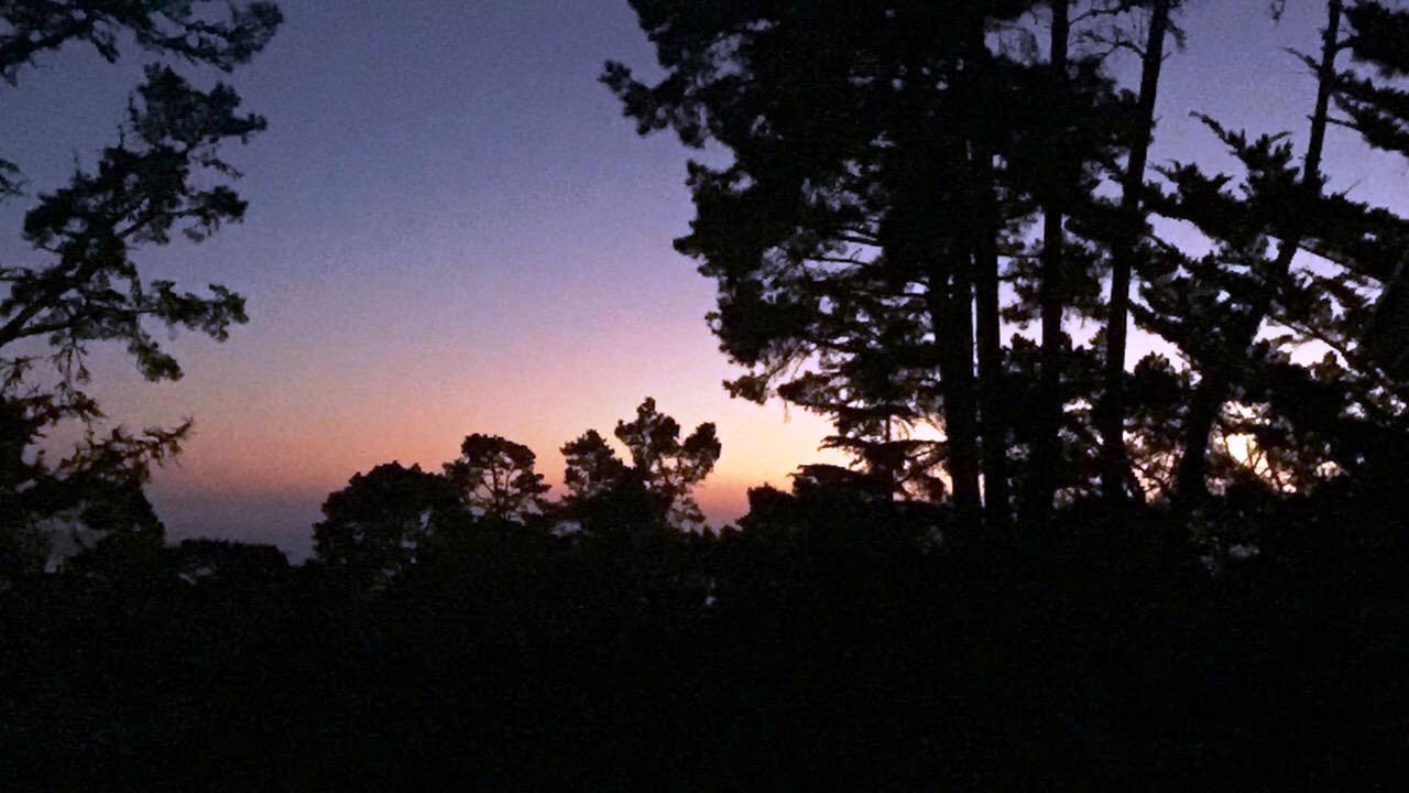 View from the Balcony of the Sunset Over the Distant Ocean