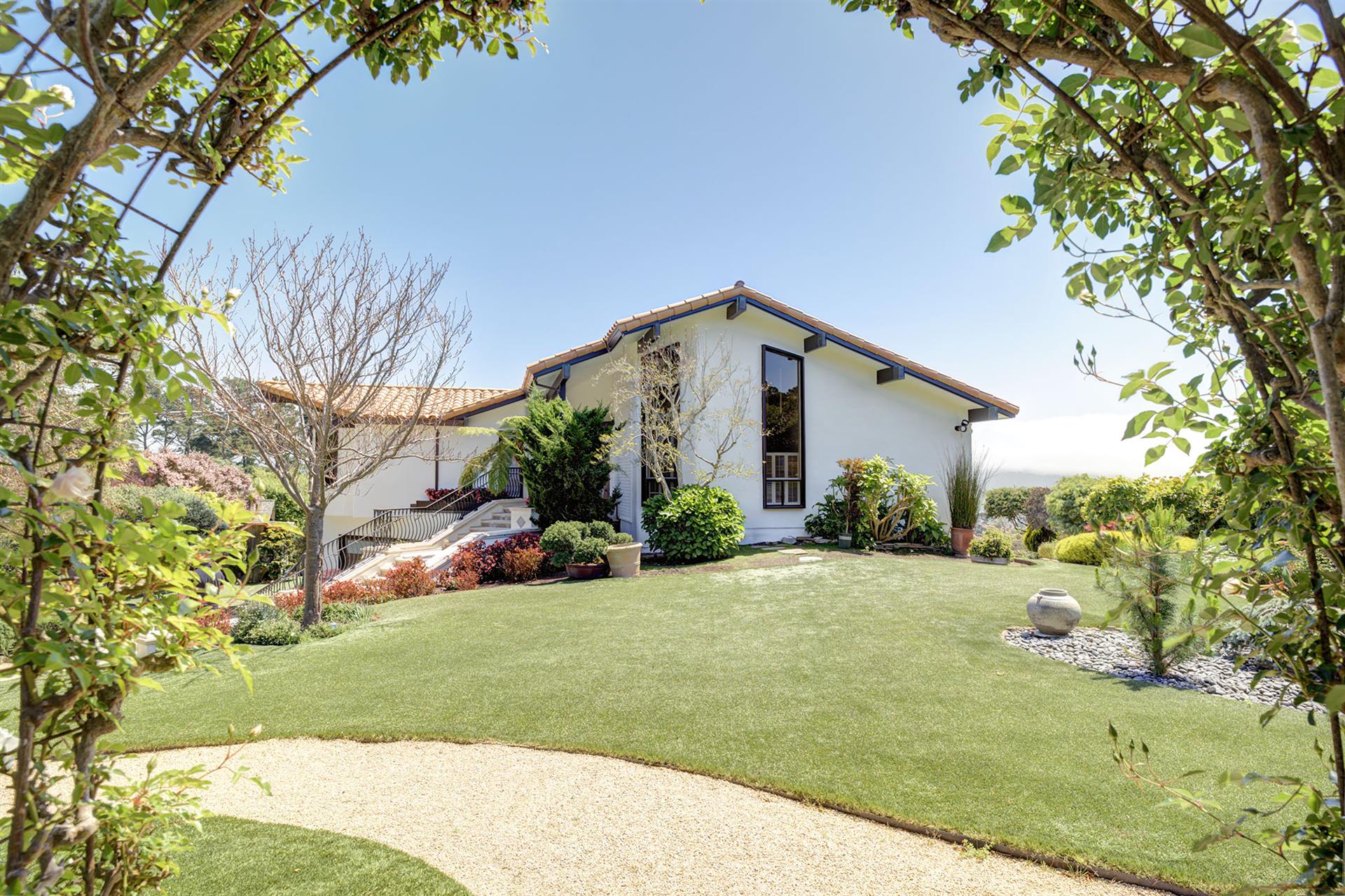 Hilltop Home on Spacious Grounds with Beautiful Landscaping