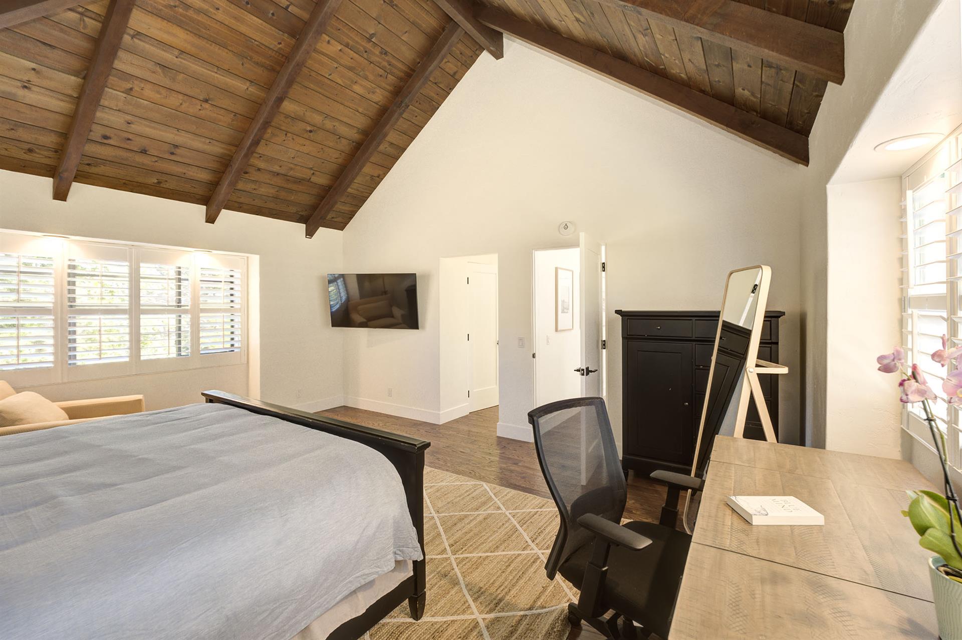 Bedroom 1  King Bed, TV, En Suite Bath and Desk