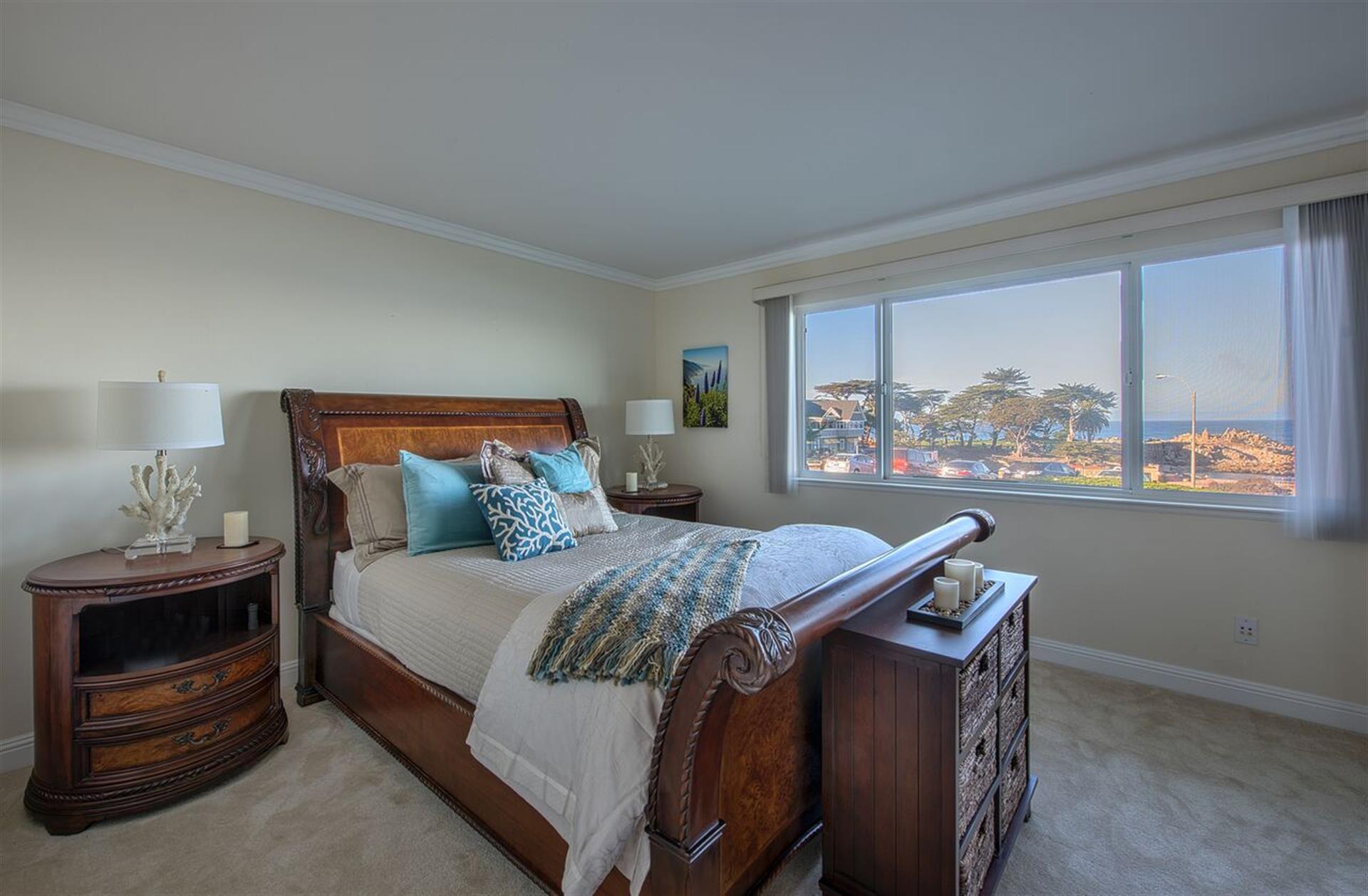 Bedroom 1 has a Plush Queen Bed and Bay View