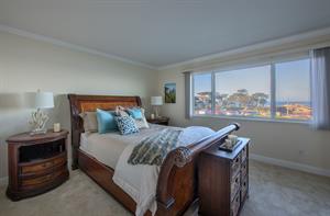 Bedroom 1 has a Plush Queen Bed and Bay View