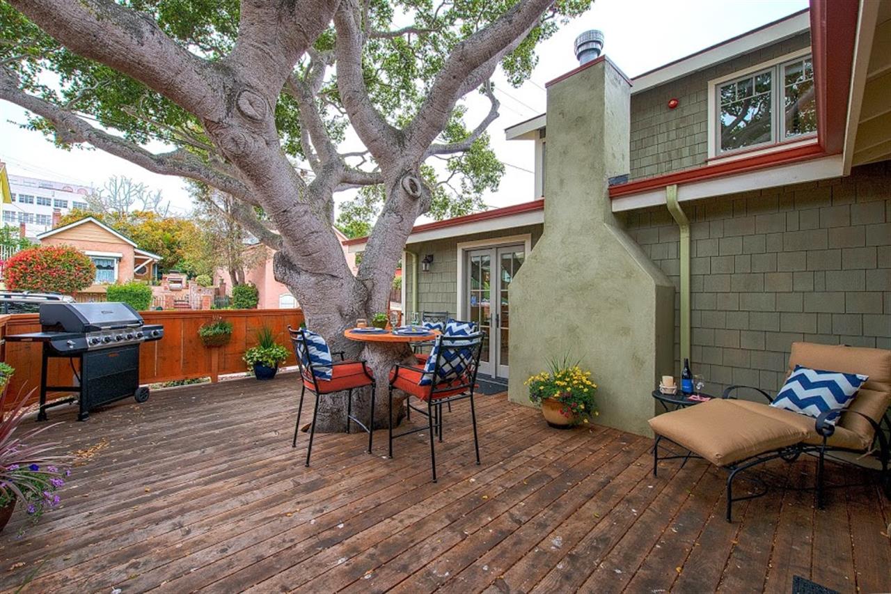 Fenced Backyard Deck with Gas Grill and Seating