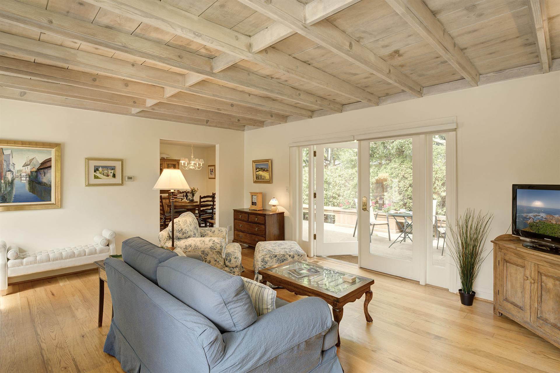 Living Room has French Doors Leading to the Backyard Patio