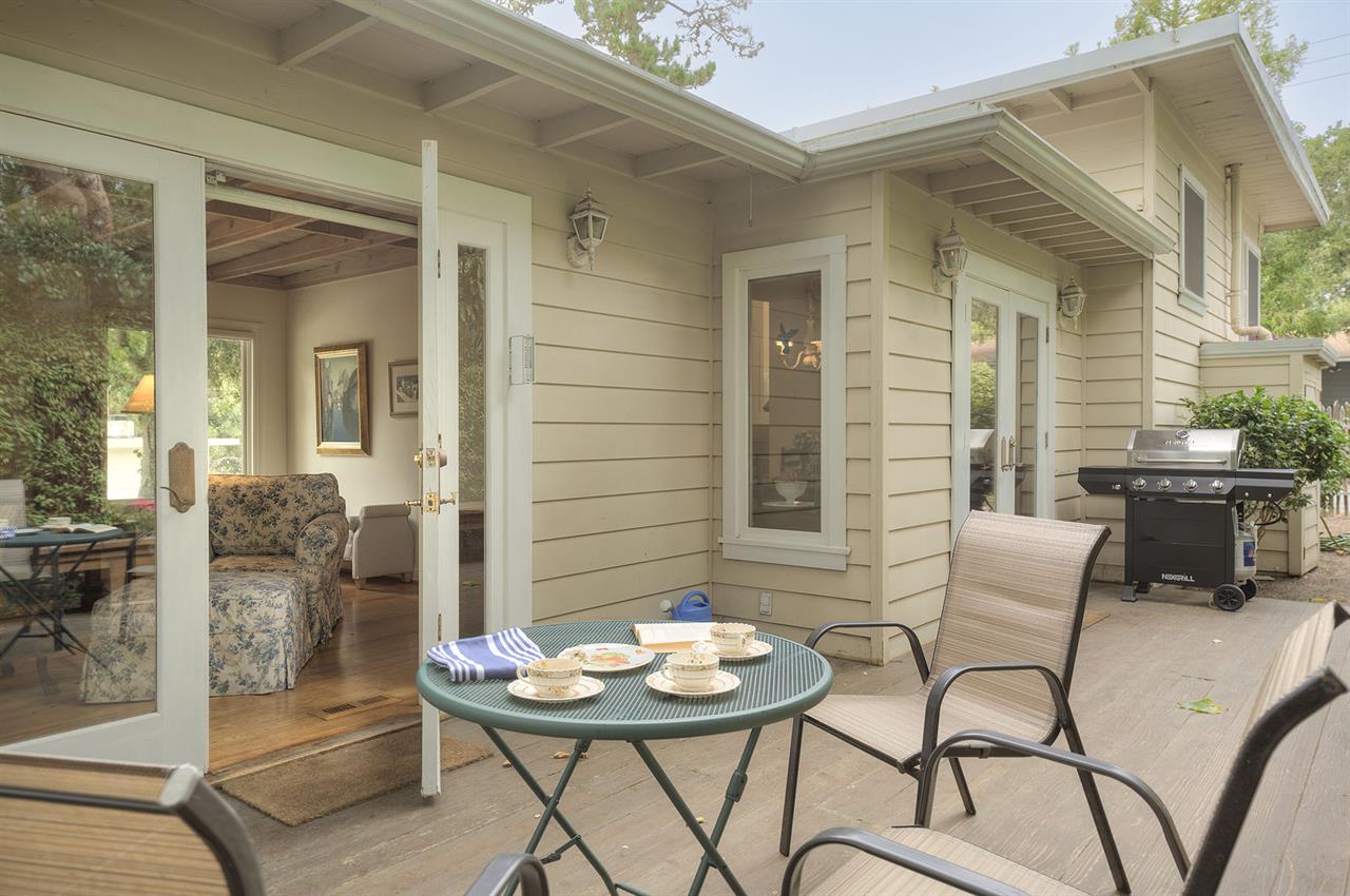 Backyard Deck has Dining Area and a Gas Grill