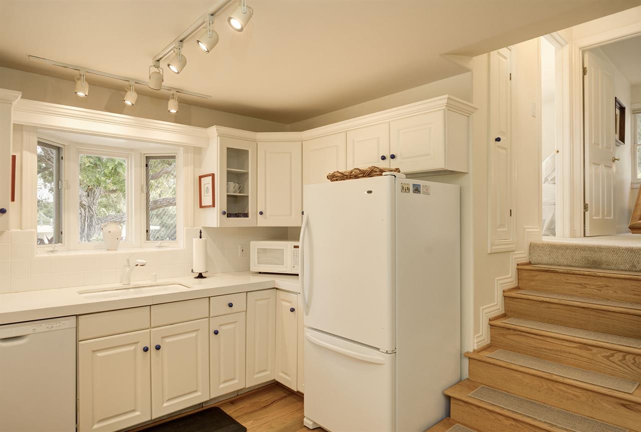Fully Equipped Kitchen  Stairs Leading to the Bedrooms and Bath