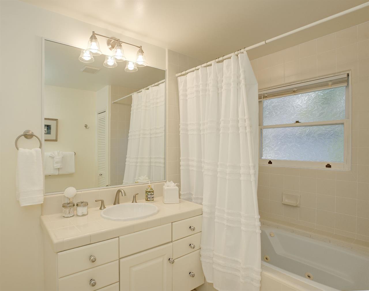 Bathroom has a Shower Over Tub