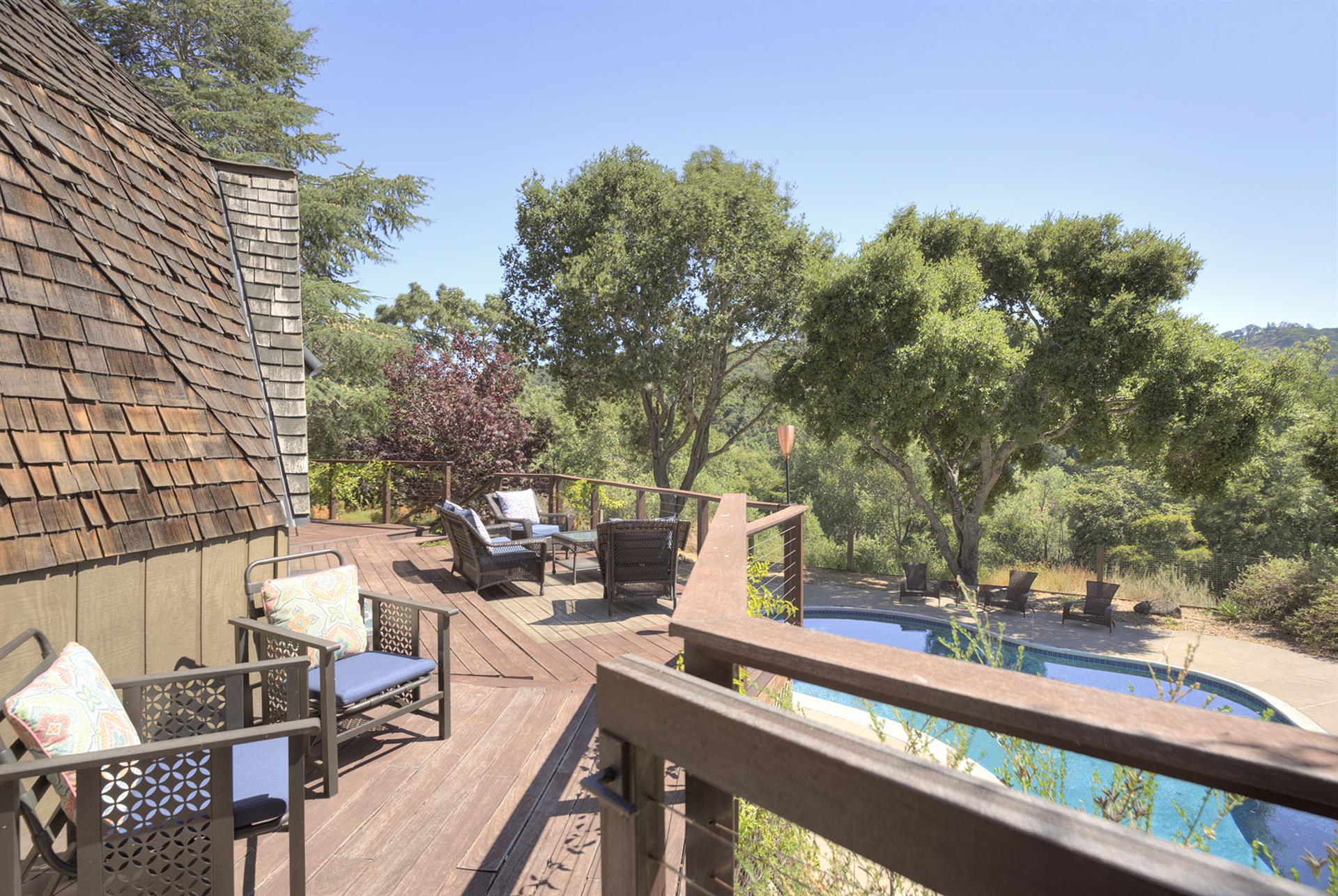 Spacious Balcony with a View of the Pool and the Hills