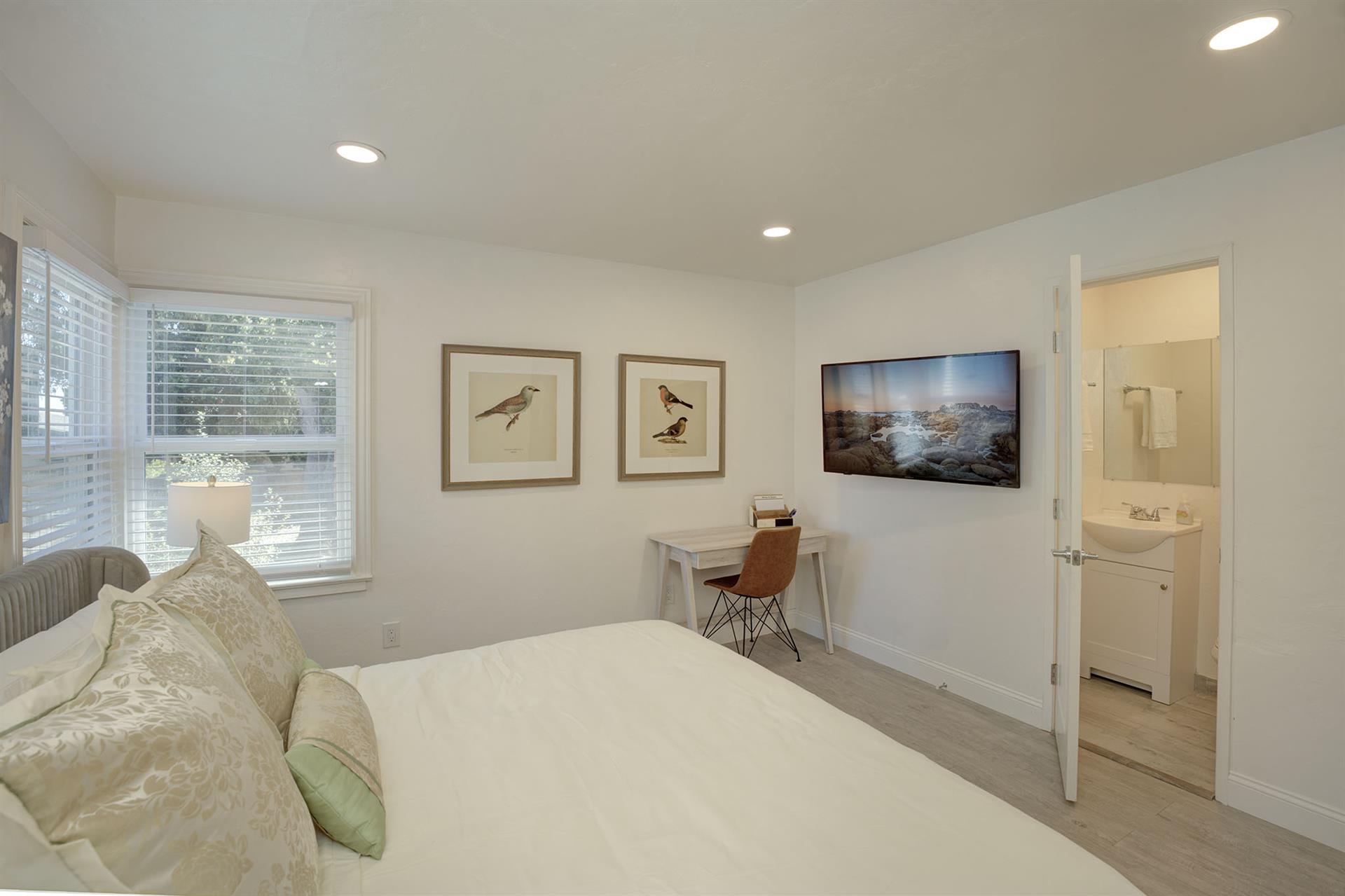 Bedroom with HDTV and En Suite Half Bath
