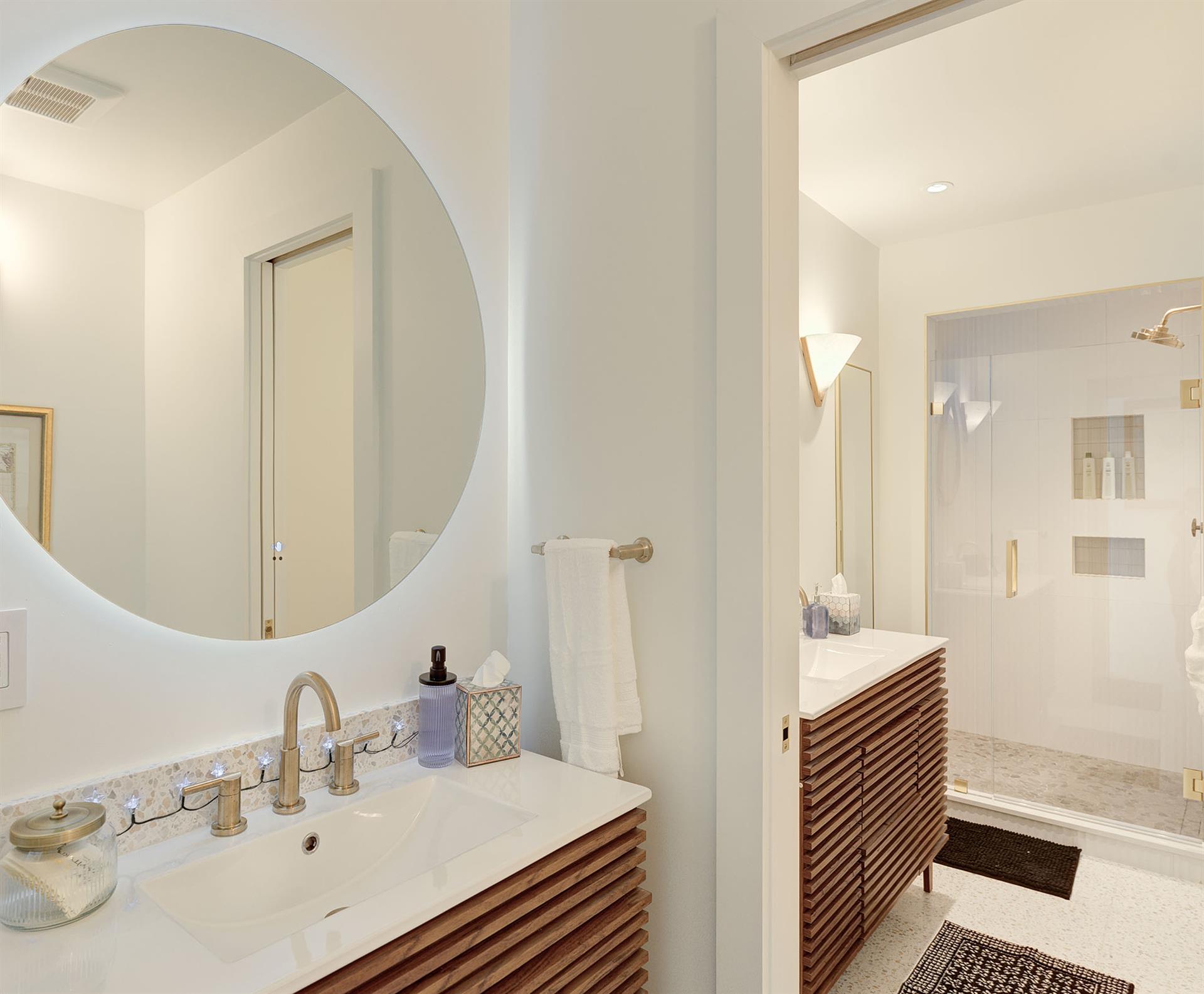 Main Floor  Bathroom 3 has a Shower and Two Vanities