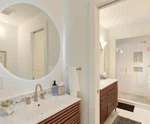 Main Floor  Bathroom 3 has a Shower and Two Vanities