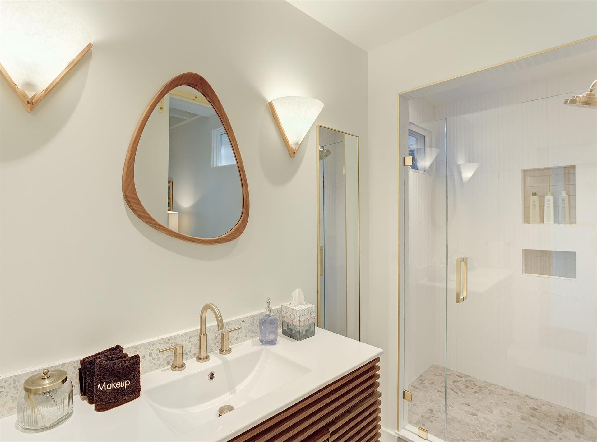 Main Floor  Bathroom 3 has a Shower and Two Vanities