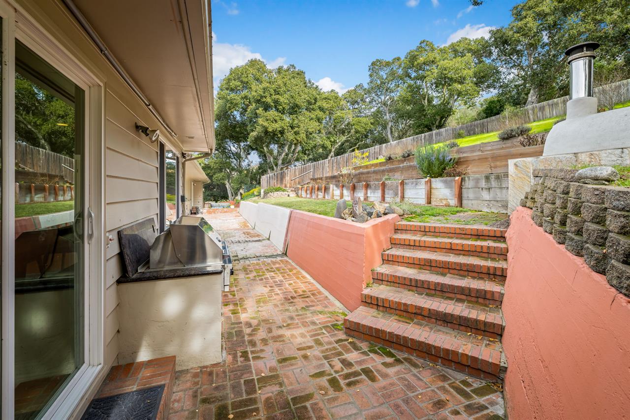 Backyard has an Outdoor Kitchen